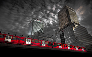 Red train tall buildings cloudy - colin gill free wallpaper