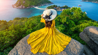 Woman yellow dress hat ocean 2 - over the ocean free wallpaper