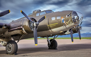 Silver airplane woman mountains clouds - a silver airplane free wallpaper