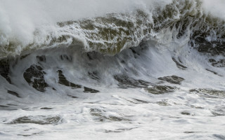 Surfing wave stormy ocean mountains - in the ocean free wallpaper
