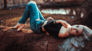 Woman lying woods blurry blue - in the wood free wallpaper