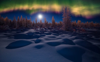 Night sky mountains reflection clouds - a bright light in the distance free wallpaper