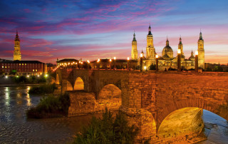 Bridge river castle night lights - a castle in the background free wallpaper for desktop