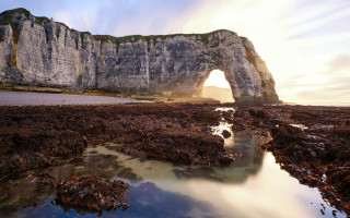 Large arch rock landscape city - a large rock formation free wallpaper