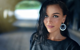 Woman black shirt earrings blue - realistic eye free wallpaper