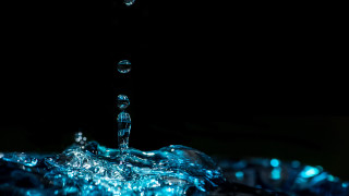 Blue water splash glowing macro - water free wallpaper