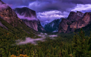 Mountain range valley trees clouds - moody free wallpaper