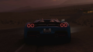 Blue sports car night road - a red tail light free wallpaper