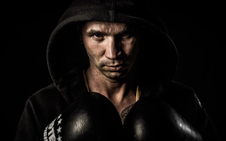 Man boxing gloves hoodie portrait - a picture in the dark free wallpaper