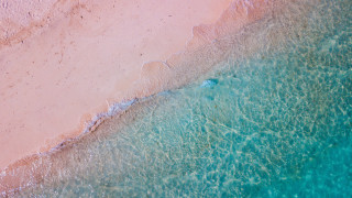 Beach boat person sandy shore - the water and a person free wallpaper