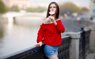 Woman red top holding white - a white object free wallpaper