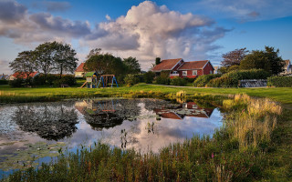 Pond house playground cloudy sky - a pond free wallpaper