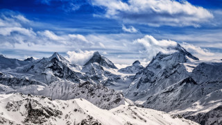 Mountain range snowy peaks clouds - dürer free wallpaper