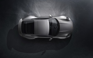 Silver sports car above dark 2 - a spotlight free wallpaper