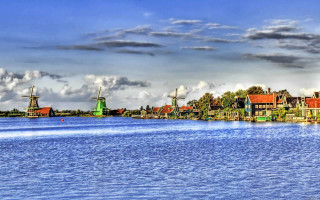 River houses windmills cloudy sky 4 - impressionism free wallpaper