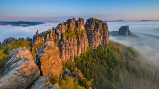 Mountain forest foggy sky rock - a forest below free wallpaper