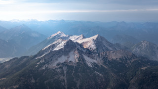 Mountain range snow capped city - free mountains wallpaper