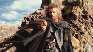 Man holding gun mountain sky - enki bilal free wallpaper