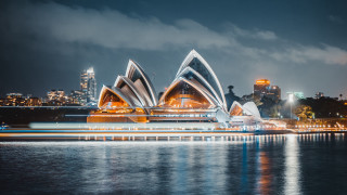 Large building city lights water - the water near a city free wallpaper