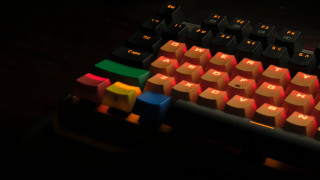 Keyboard red light black background - a close up of a keyboard free wallpaper