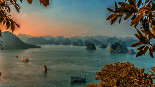 Boats water mountains trees sunset - a group of boats free wallpaper for desktop