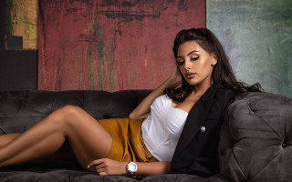 Woman couch crossed legs watch - a watch free wallpaper