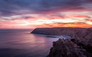 Sunset rocky cliff water cityscape - a sunset view free wallpaper