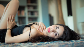 Woman lying crossed legs bokeh - her leg up free wallpaper