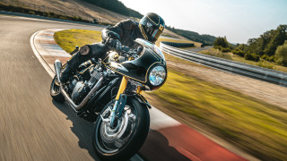 Motorcycle riding man curvy road - a lush green hillside free wallpaper