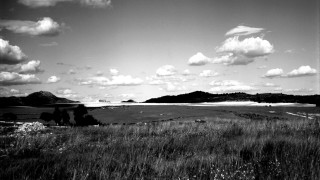 Black white field mountains clouds - photo of a field free wallpaper
