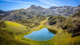 Mountain lake landscape blue sky 2 - a mountain range in the background free wallpaper