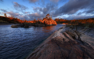 Lake rock outcropping trees dusk - rim light free wallpaper