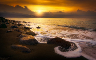 Sunset ocean waves rocks mountains 2 - a rocky shoreline free wallpaper