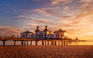 Pier building sunset clouds water - a pier free wallpaper