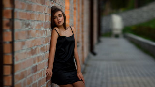 Woman brick wall black dress - a black dress and heels free wallpaper