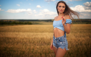 Woman blue top field wind 2 - a blue top free wallpaper