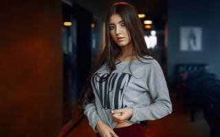 Woman grey sweater hallway blue - grey free wallpaper