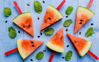 Watermelon slices mint leaves blue - a blue surface free wallpaper