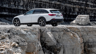White car cliff rock formation - a white car free wallpaper