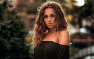 Woman long hair black top 11 - a tree and a building free wallpaper