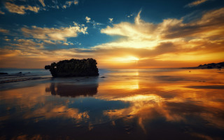 Sunset beach island clouds dusk - a sunset over a beach free wallpaper