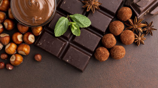 Chocolate nuts mint leaves tabletop - a chocolate bar free wallpaper