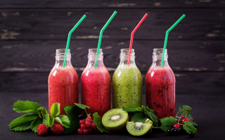 Smoothie bottles fruit table wooden - a group free wallpaper
