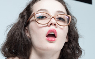 Woman glasses surprised face open - her mouth open free wallpaper