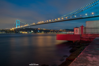 Bridge water lighthouse building nightscape - a bridge over water free wallpaper