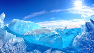 Floating iceberg sun blue sky - a large iceberg free wallpaper