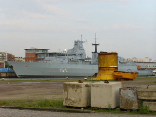 Large ship docked harbor concrete - flemish free wallpaper