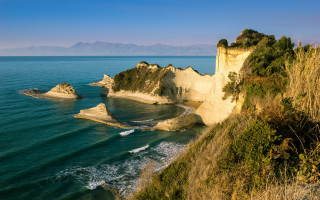 Exekias beach cliff waves ocean - a cliff and a body of water free wallpaper