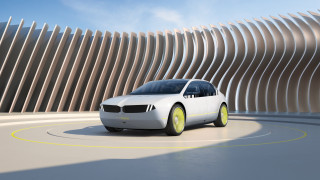 White car driving curved building - vray free wallpaper