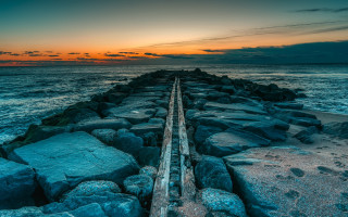 Pier rocky beach sunset cloudy - adobe lightroom free wallpaper